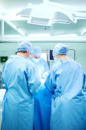 stock-photo-57229086-surgeons-operating-patient-in-surgery-room